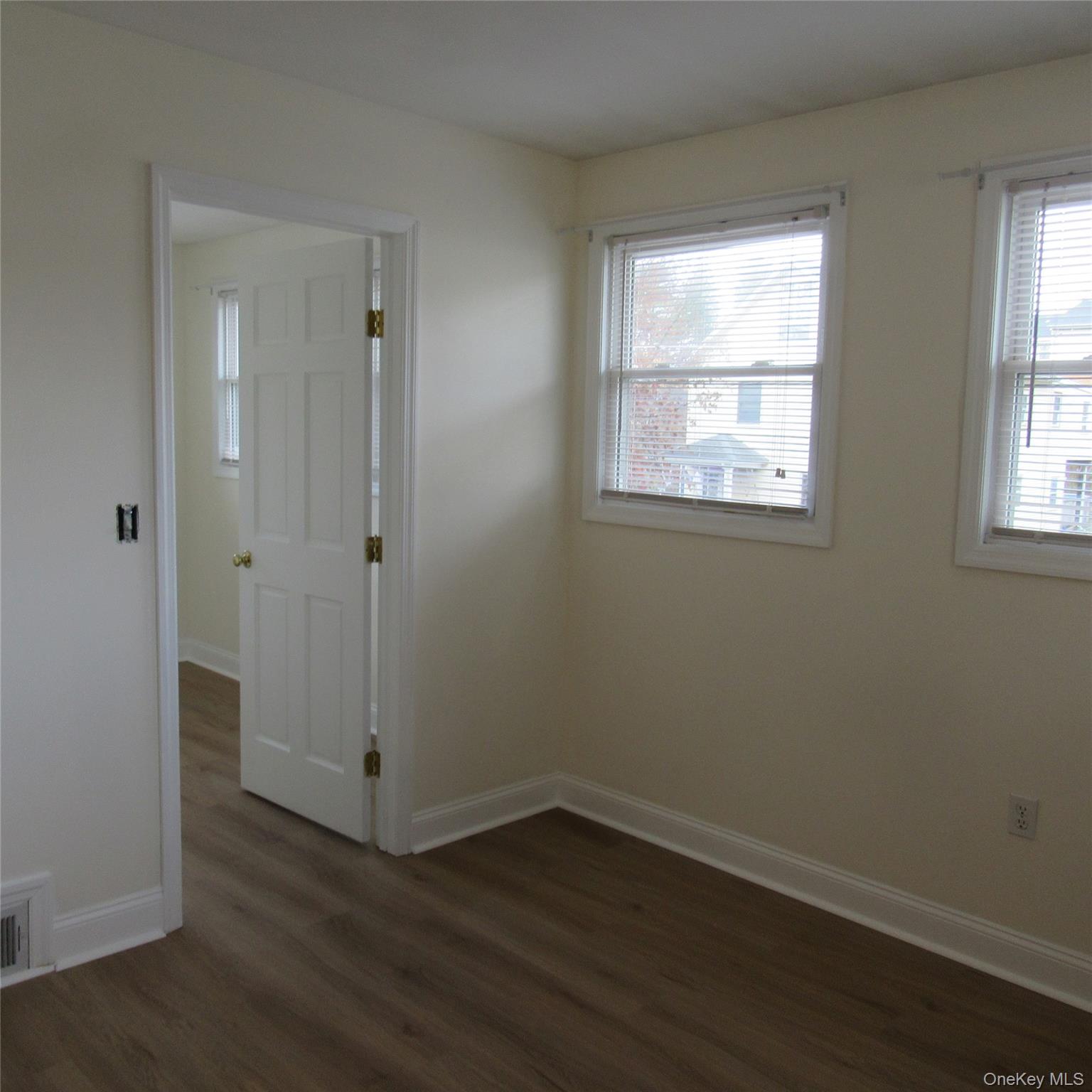 35 Taylor Avenue, Unit 2 Poughkeepsie, NY 12601 - Photo 14 of 19 an empty room with wooden floor and windows