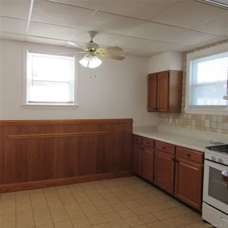a view of a kitchen with a sink and dishwasher cabinet