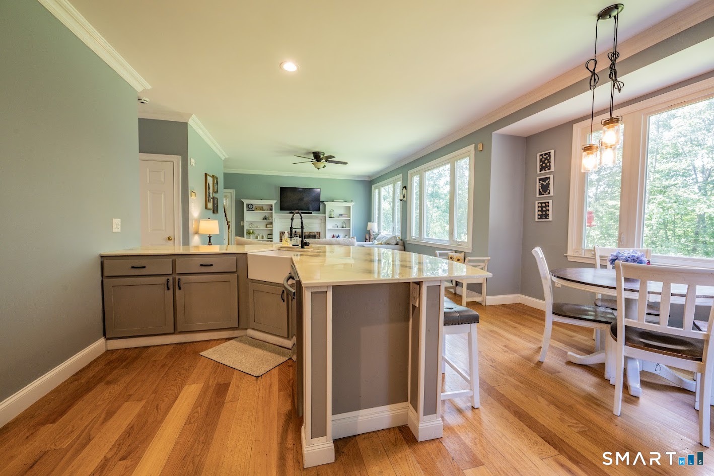 76 R Ivy Way Durham, CT 06422 - Photo 7 of 19 The heart of the home features a large center island with seating, sunny dining area, and an open layout designed for gathering.