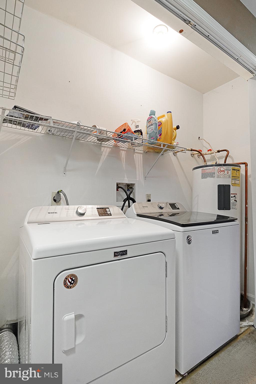 239 Norwich Way Dover, DE 19901 - Photo 18 of 34 Hall laundry with shelving and hot water heater