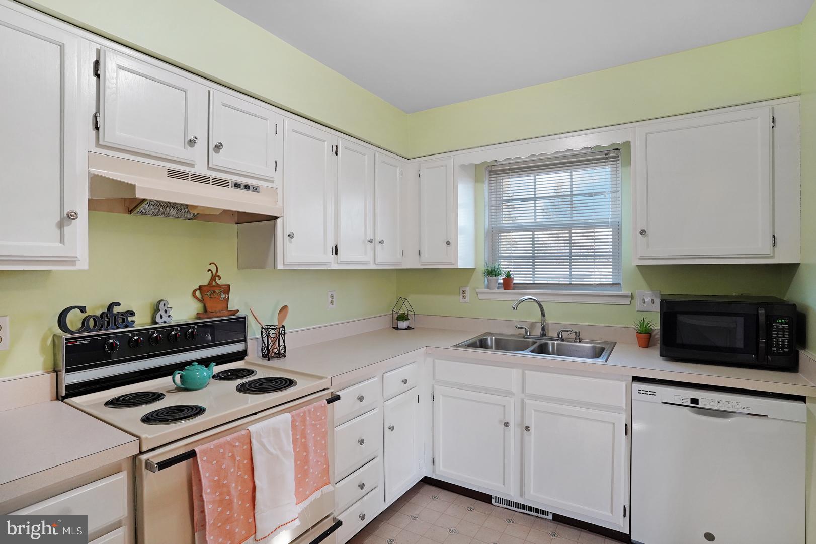 239 Norwich Way Dover, DE 19901 - Photo 8 of 34 Sunny Kitchen with well placed white cabinetry