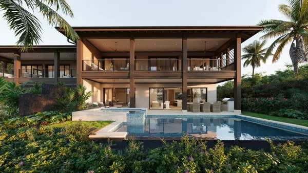 an aerial view of a house with swimming pool and porch