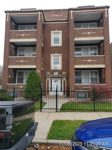 a front view of a house with a garden and plants