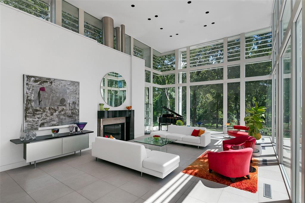 4130 Cochran Chapel Road Dallas, TX 75209 - Photo 1 of 40 a living room with furniture fireplace and flat screen tv