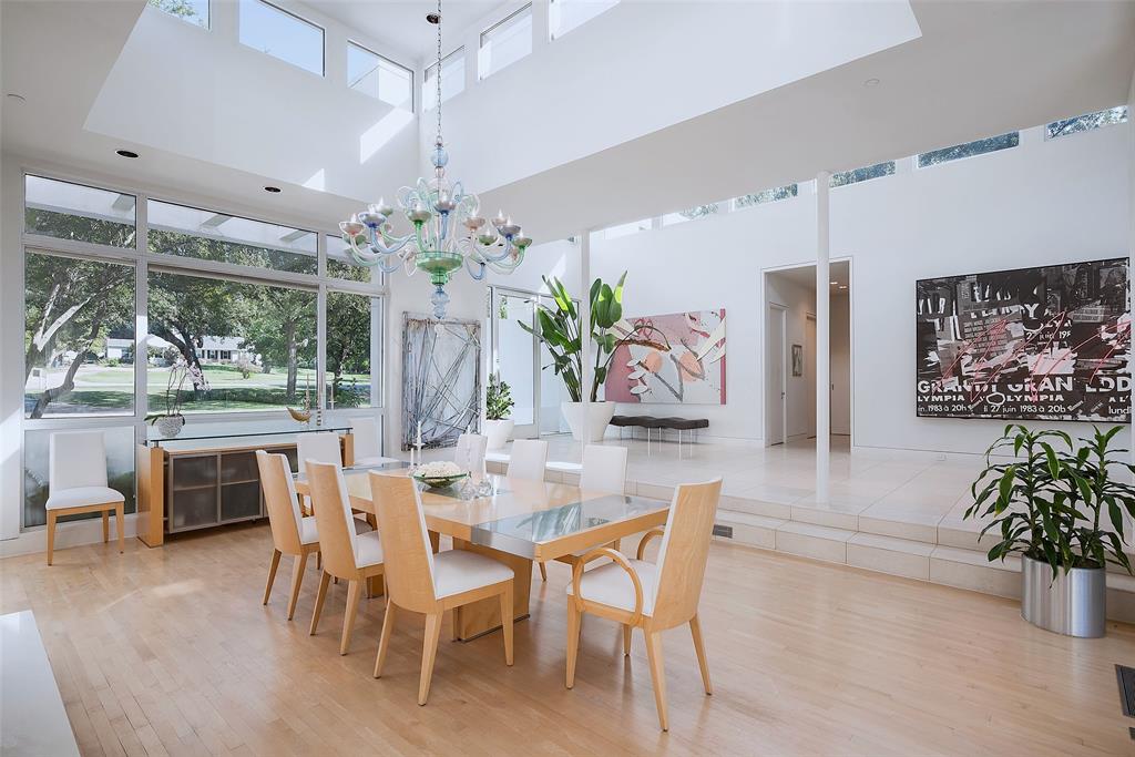 4130 Cochran Chapel Road Dallas, TX 75209 - Photo 13 of 40 a dining room with furniture a large window and a chandelier