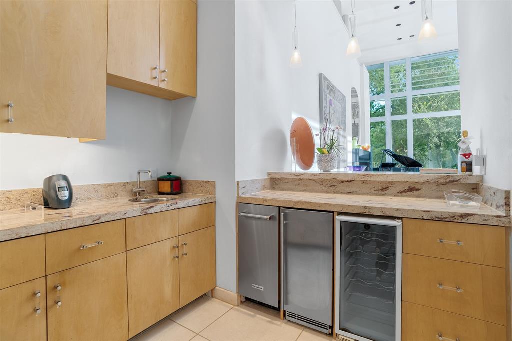 4130 Cochran Chapel Road Dallas, TX 75209 - Photo 21 of 40 a kitchen with granite countertop a sink and a stove