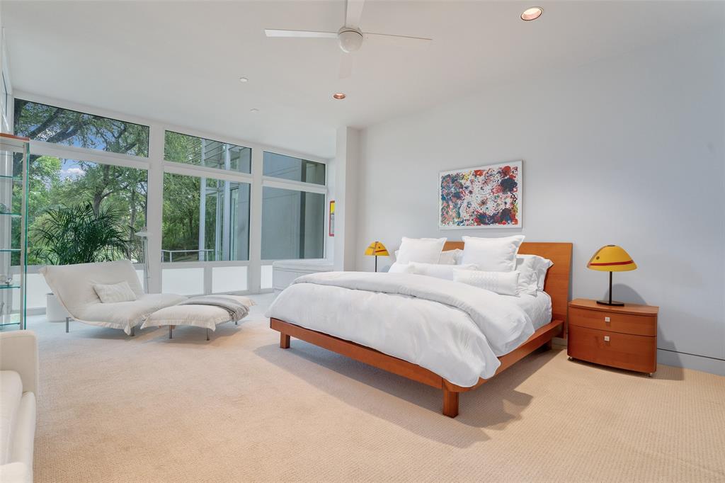 4130 Cochran Chapel Road Dallas, TX 75209 - Photo 32 of 40 a bed room with a bed and a large window