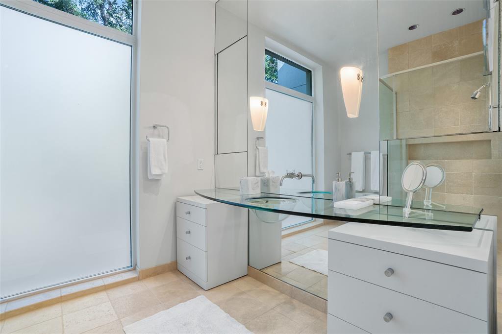 4130 Cochran Chapel Road Dallas, TX 75209 - Photo 34 of 40 a bathroom with a granite countertop sink and a mirror