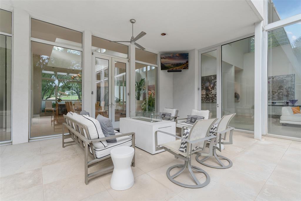 4130 Cochran Chapel Road Dallas, TX 75209 - Photo 40 of 40 a view of a livingroom with furniture and floor to ceiling window