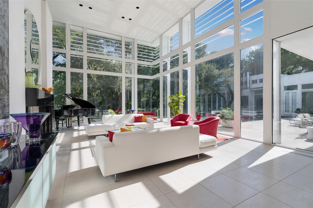 4130 Cochran Chapel Road Dallas, TX 75209 - Photo 8 of 40 a living room filled with furniture and a large window