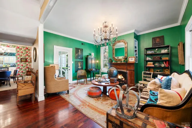 a view of a livingroom with furniture and hardwood floor
