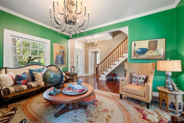 a kitchen with stove and flowers in it