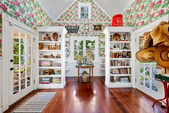 a bedroom with two bed and a lamp on dresser