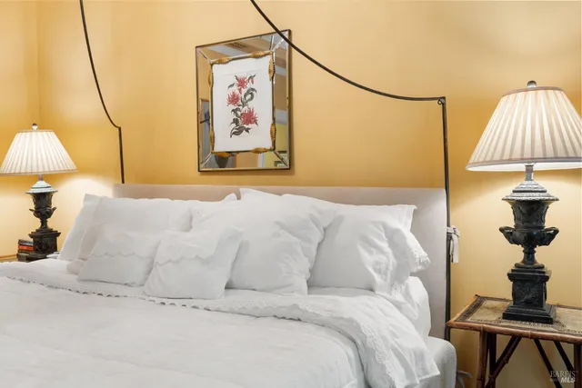a bathroom with a toilet a sink and a mirror