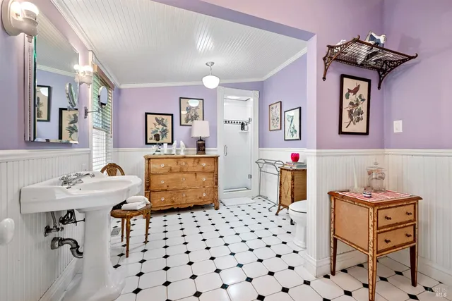 a bedroom with furniture and a wooden floor