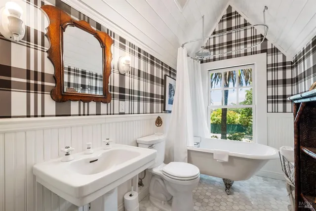 a living room with furniture or chandelier and a large window