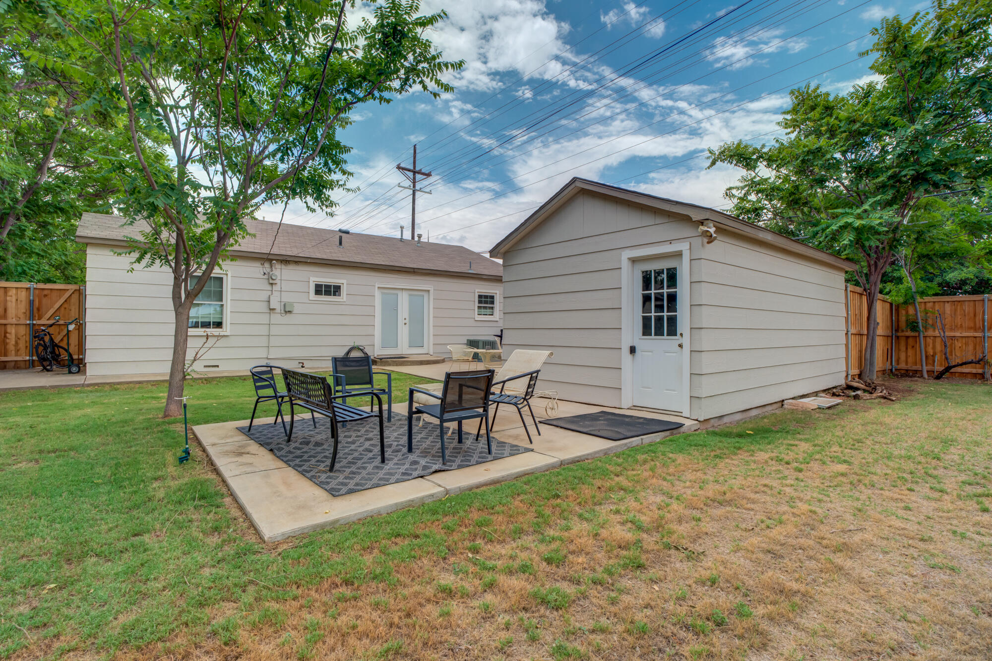 2826 33rd Street Lubbock, TX 79410 - Photo 31 of 33 a view of a house with a yard and sitting area