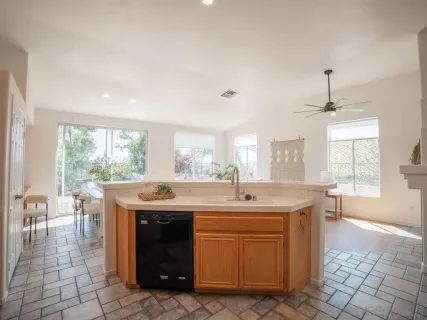 a kitchen with a sink and cabinets