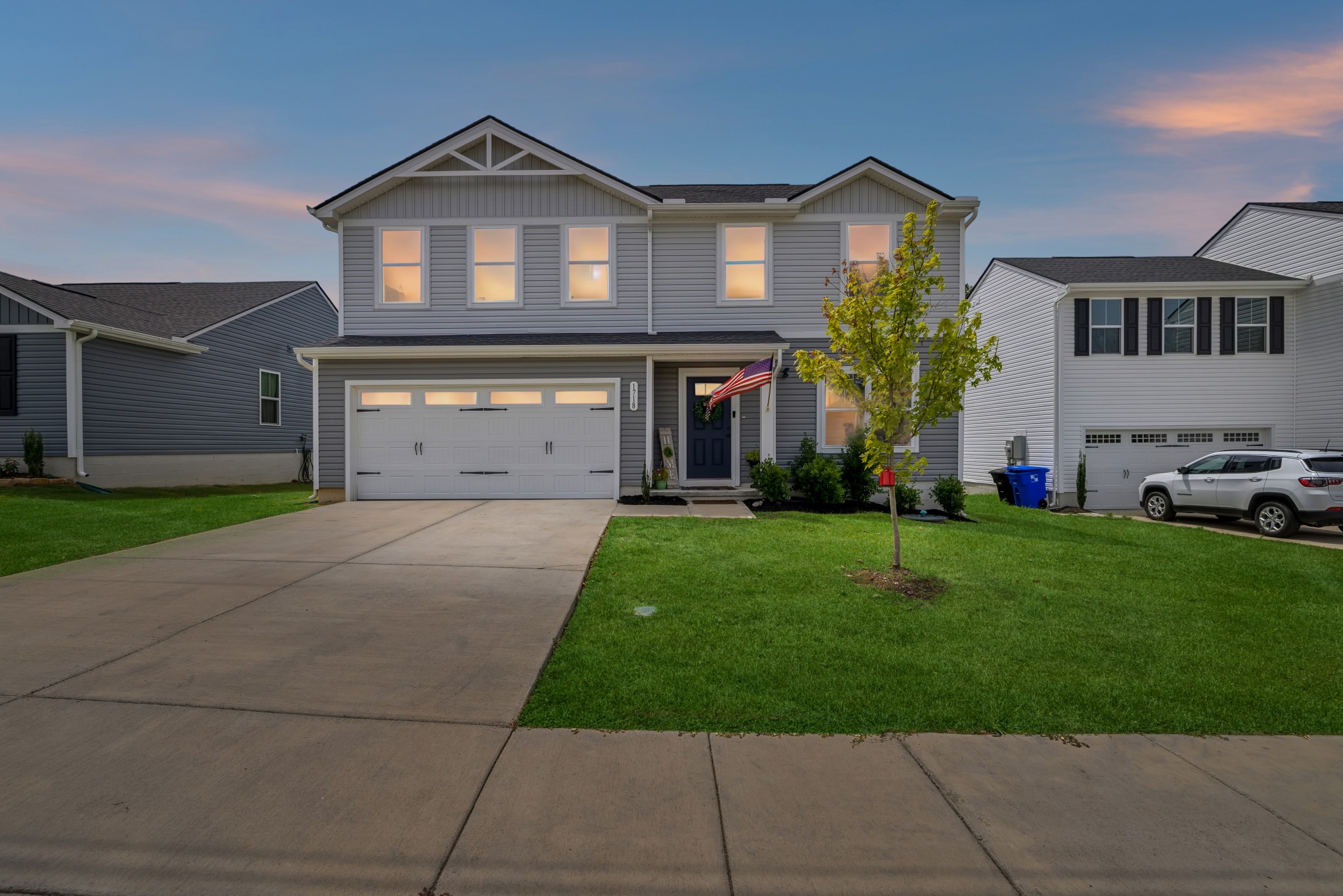 1718 Quail Run Way Spring Hill Spring Hill, TN 37174 - Photo 1 of 40 a front view of a house with a yard and garage
