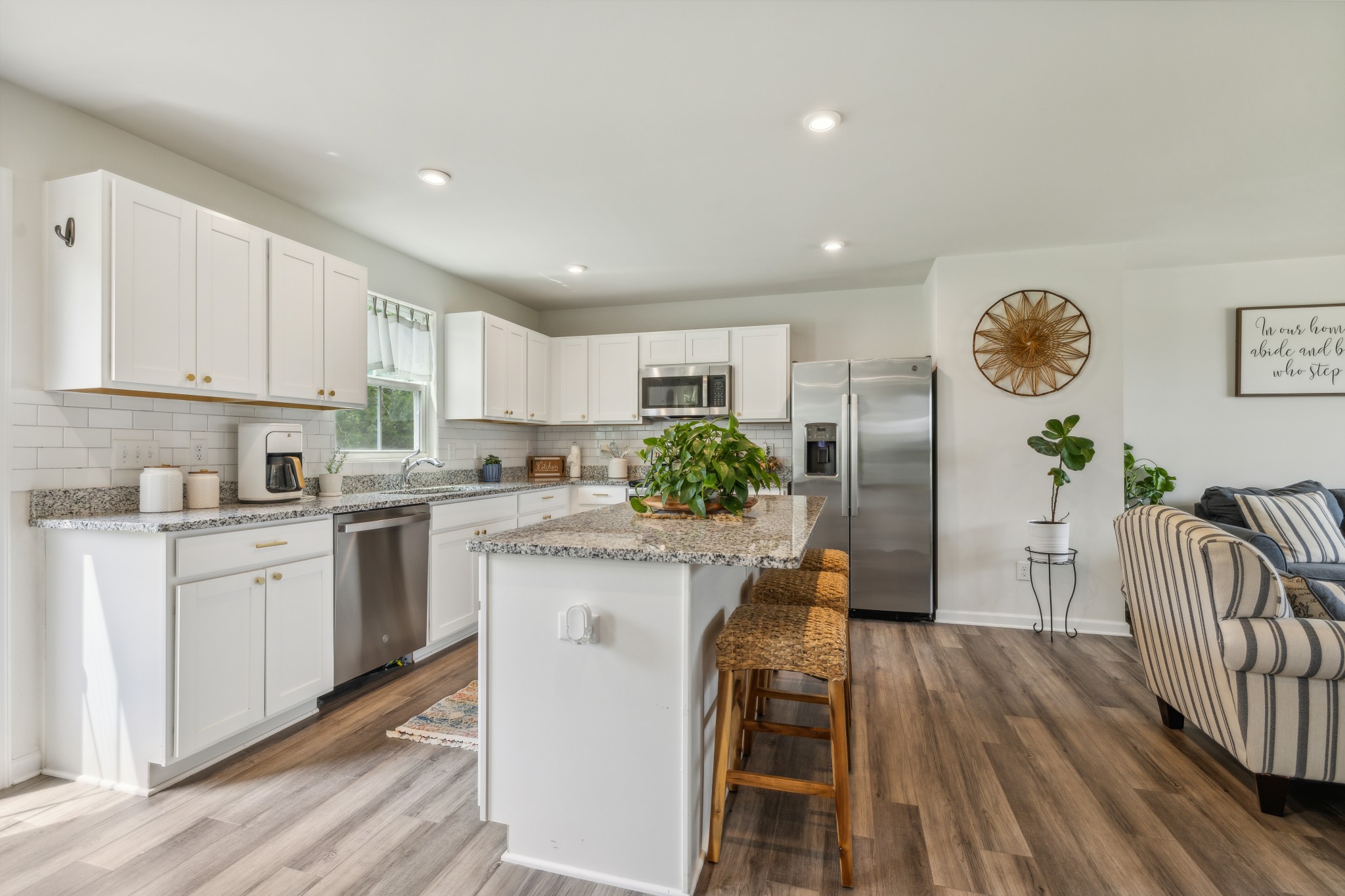 1718 Quail Run Way Spring Hill Spring Hill, TN 37174 - Photo 11 of 40 a kitchen with white cabinets and stainless steel appliances