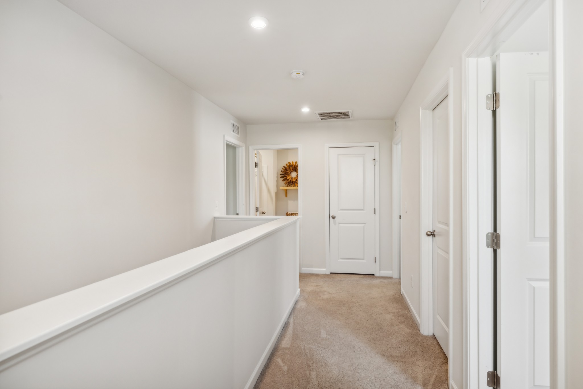 1718 Quail Run Way Spring Hill Spring Hill, TN 37174 - Photo 19 of 40 a view of a hallway with wooden floor and staircase