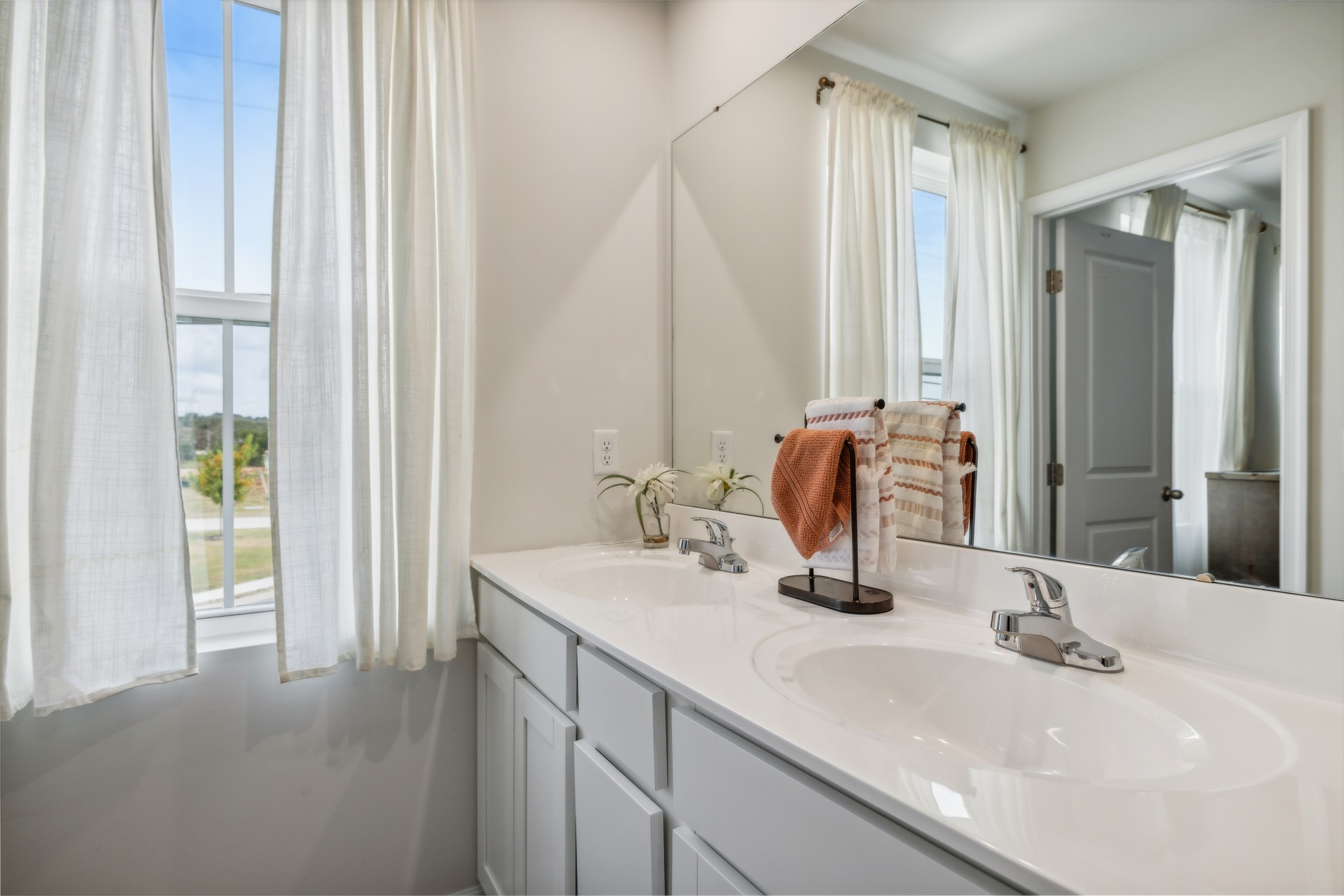 1718 Quail Run Way Spring Hill Spring Hill, TN 37174 - Photo 24 of 40 a bathroom with a double vanity sink and a mirror