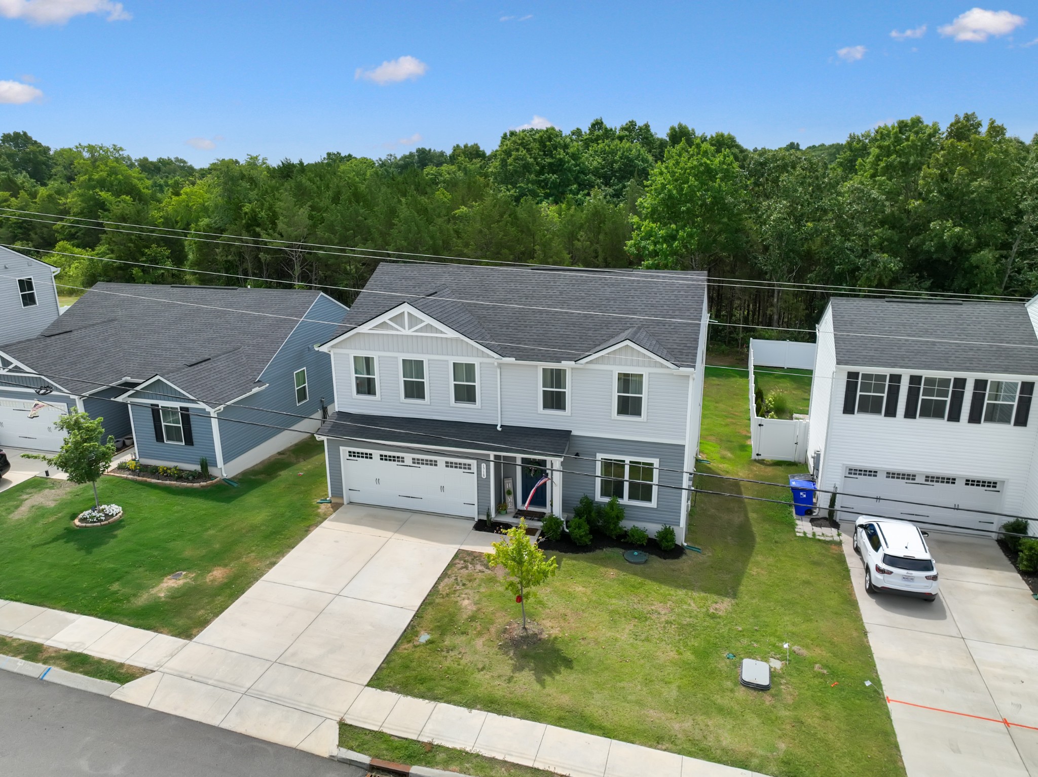 1718 Quail Run Way Spring Hill Spring Hill, TN 37174 - Photo 38 of 40 a aerial view of a house with a yard table and chairs