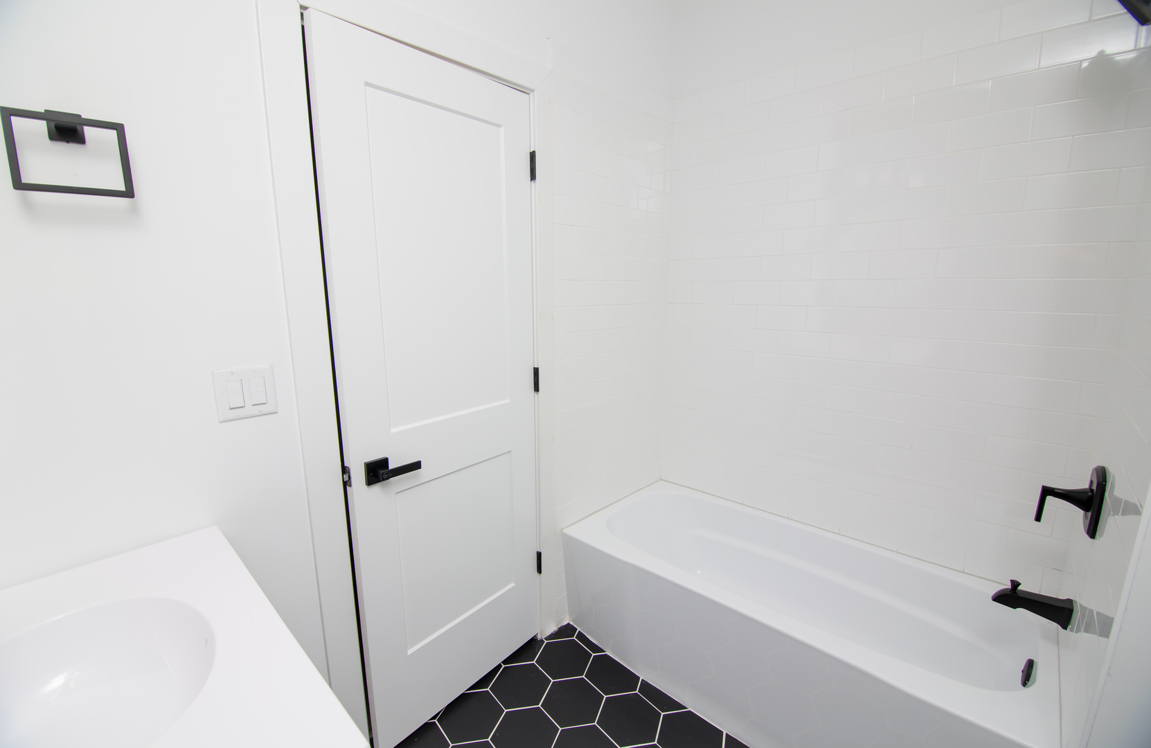 5531 South May Street Chicago, IL 60621 - Photo 9 of 11 a bathroom with a bathtub and shower