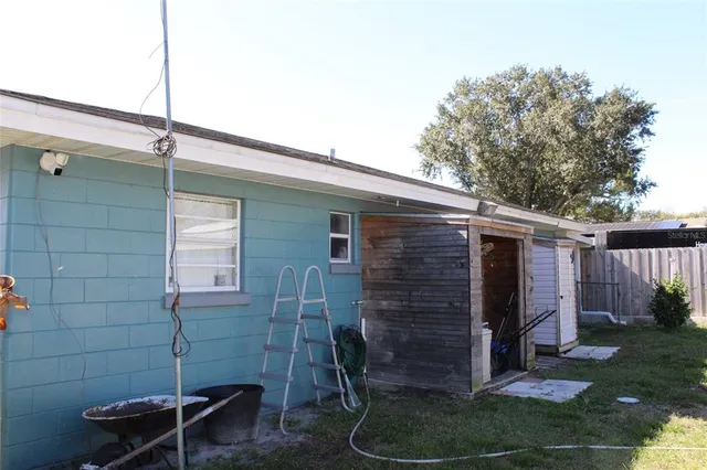 a backyard of a house with plants