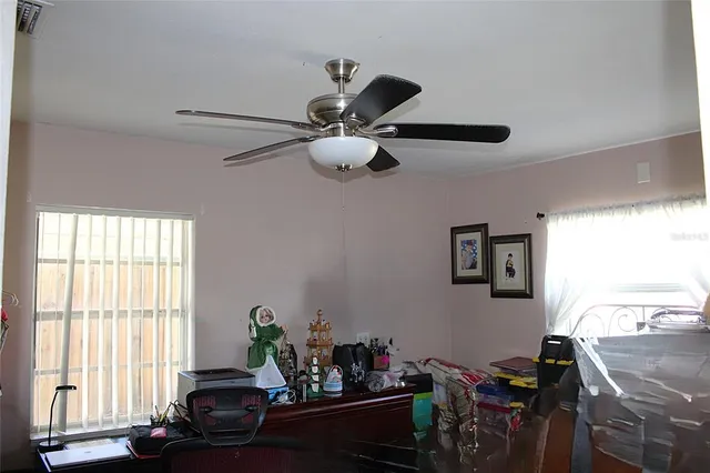 a living room with furniture and window