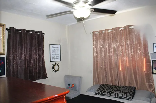 a view of room with a window and furniture