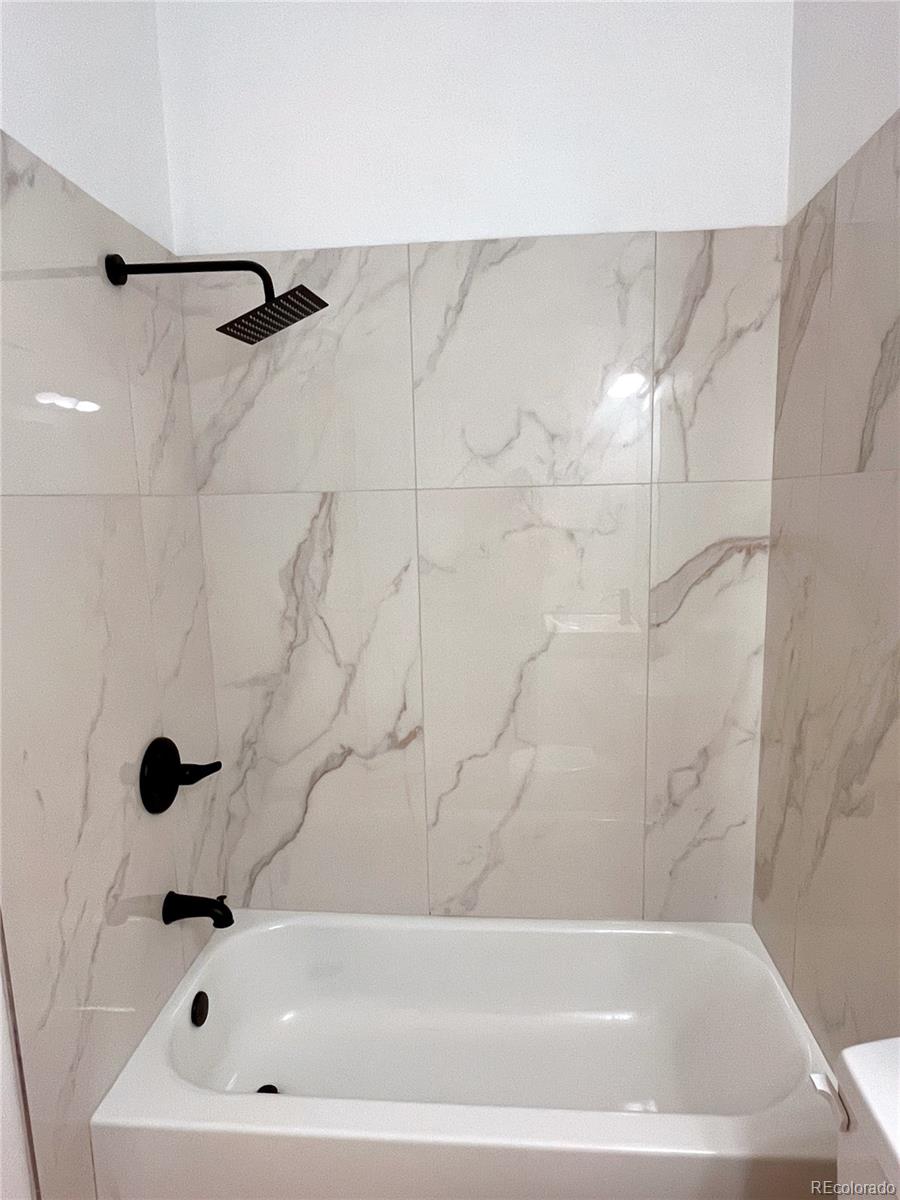 4660 Skylark Road Colorado Springs, CO 80916 - Photo 20 of 33 a bathroom with a bathtub