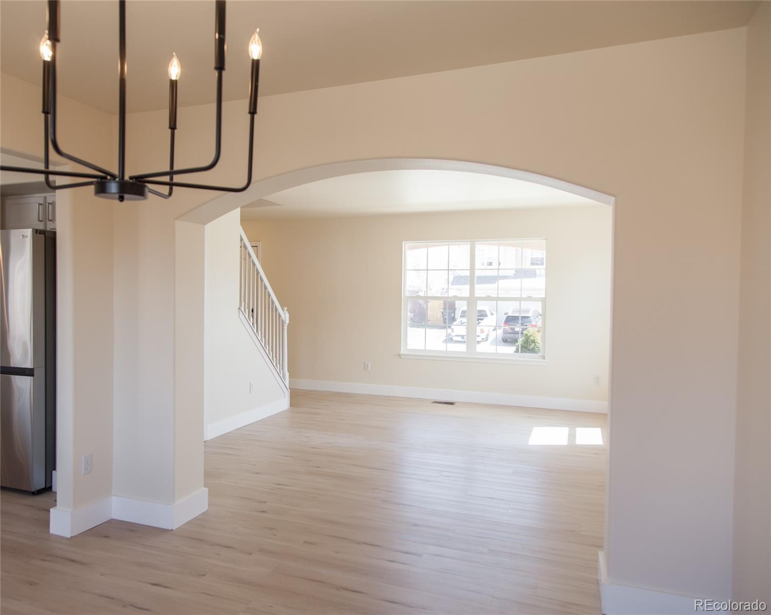 4660 Skylark Road Colorado Springs, CO 80916 - Photo 25 of 33 a view of a room with wooden floor and windows