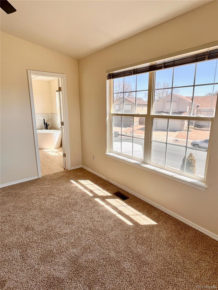 4660 Skylark Road Colorado Springs, CO 80916 - Photo 27 of 33 a view of an empty room with a window