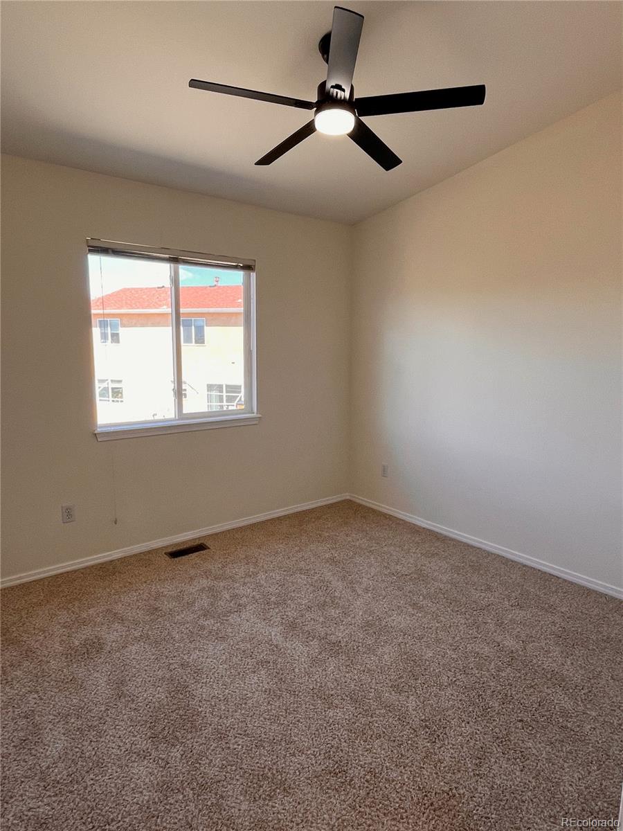 4660 Skylark Road Colorado Springs, CO 80916 - Photo 33 of 33 a view of an empty room with a window