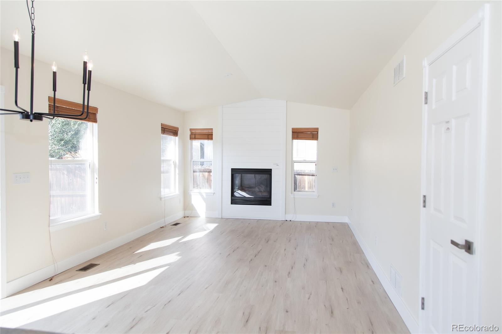 4660 Skylark Road Colorado Springs, CO 80916 - Photo 10 of 33 a view of livingroom with furniture wooden floor and window