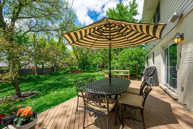 a view of a table and chairs on the roof deck