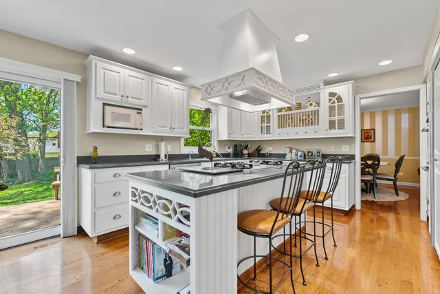 a kitchen with stainless steel appliances granite countertop a stove and a refrigerator
