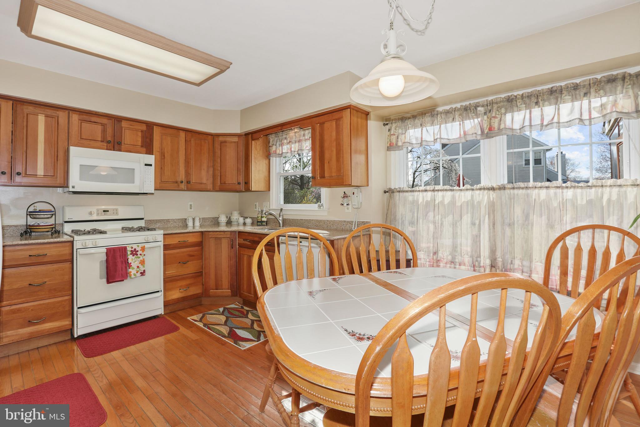 2 Burke Drive Medford, NJ 08055 - Photo 14 of 38 a spacious bedroom with a bed and a large window