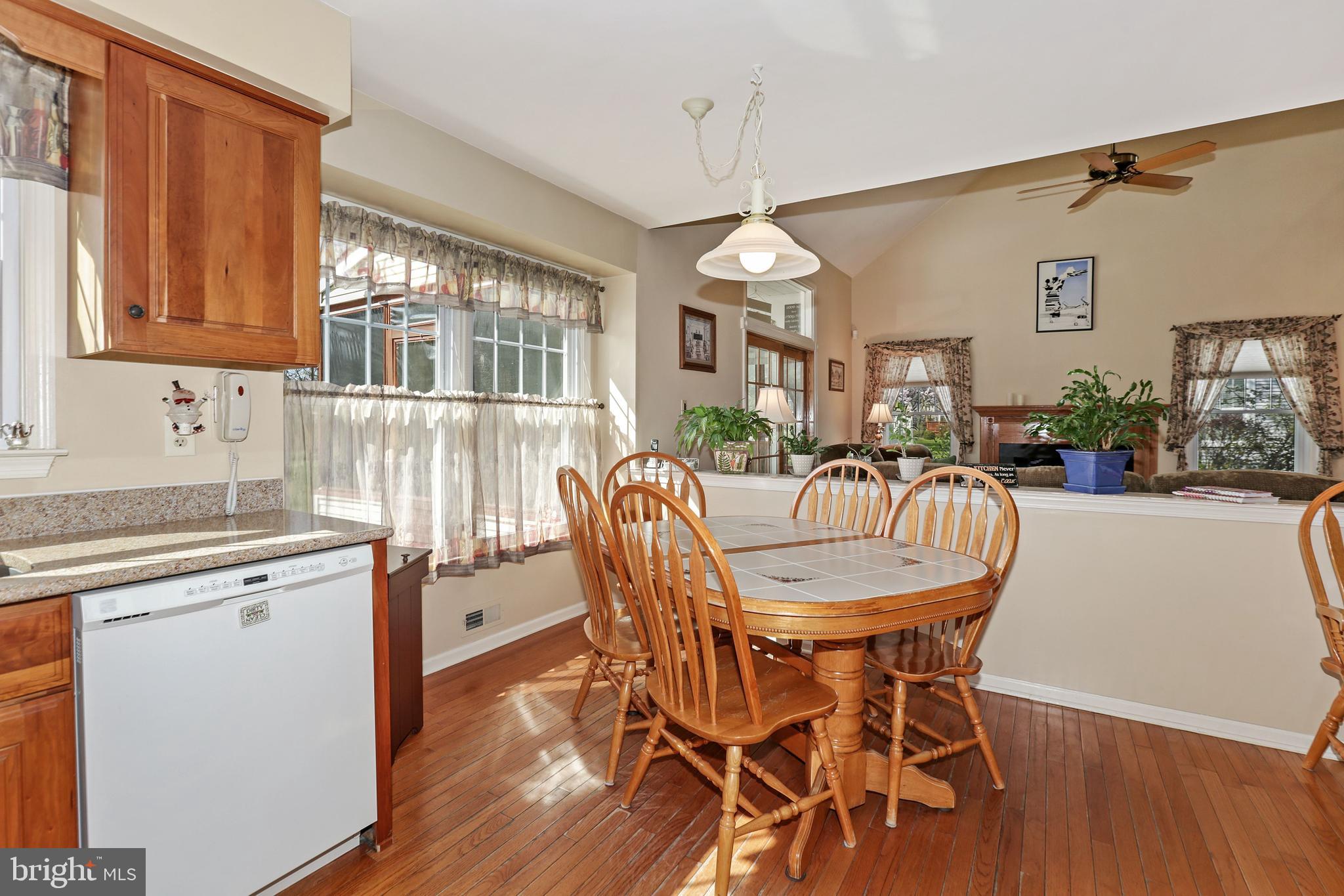 2 Burke Drive Medford, NJ 08055 - Photo 15 of 38 a dining room with furniture a chandelier and wooden floor
