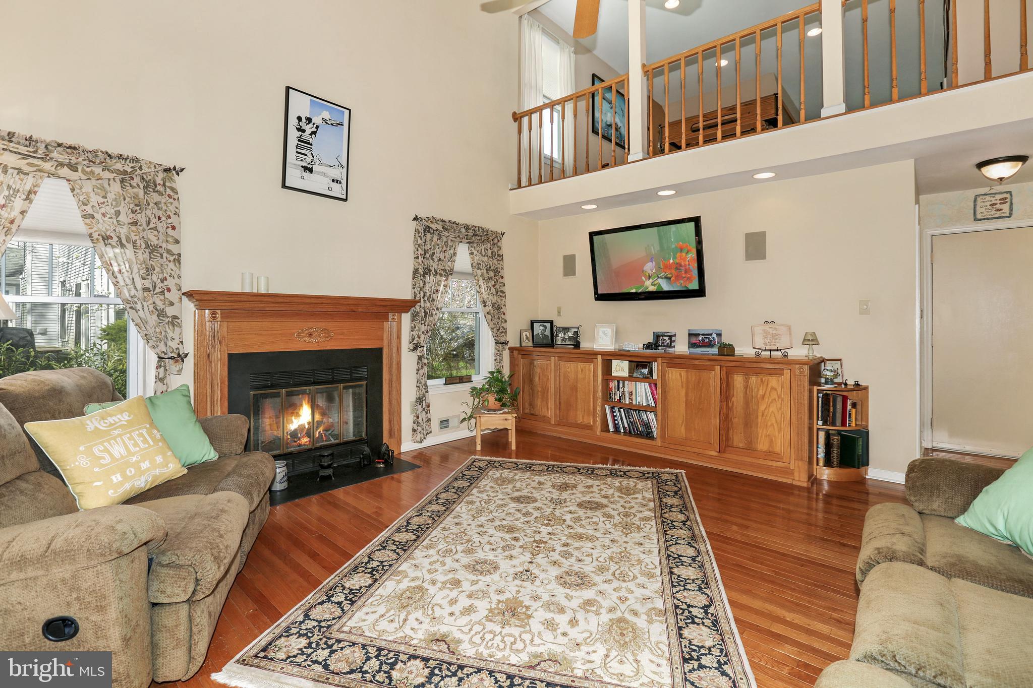 2 Burke Drive Medford, NJ 08055 - Photo 17 of 38 a living room with furniture and a fireplace