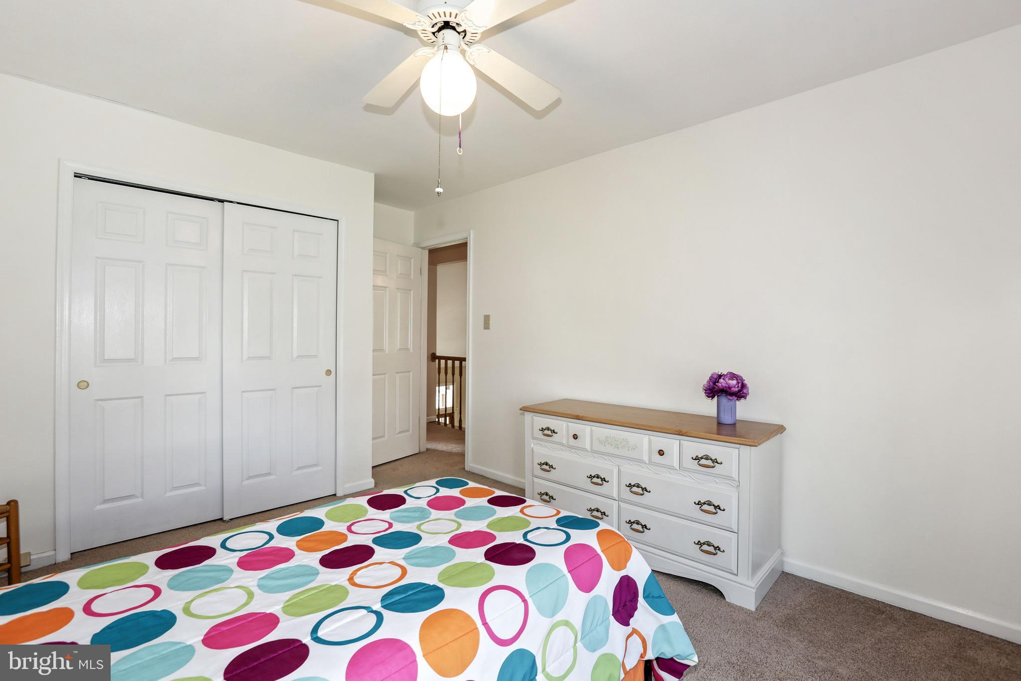 2 Burke Drive Medford, NJ 08055 - Photo 29 of 38 a bedroom with a bed and a chandelier