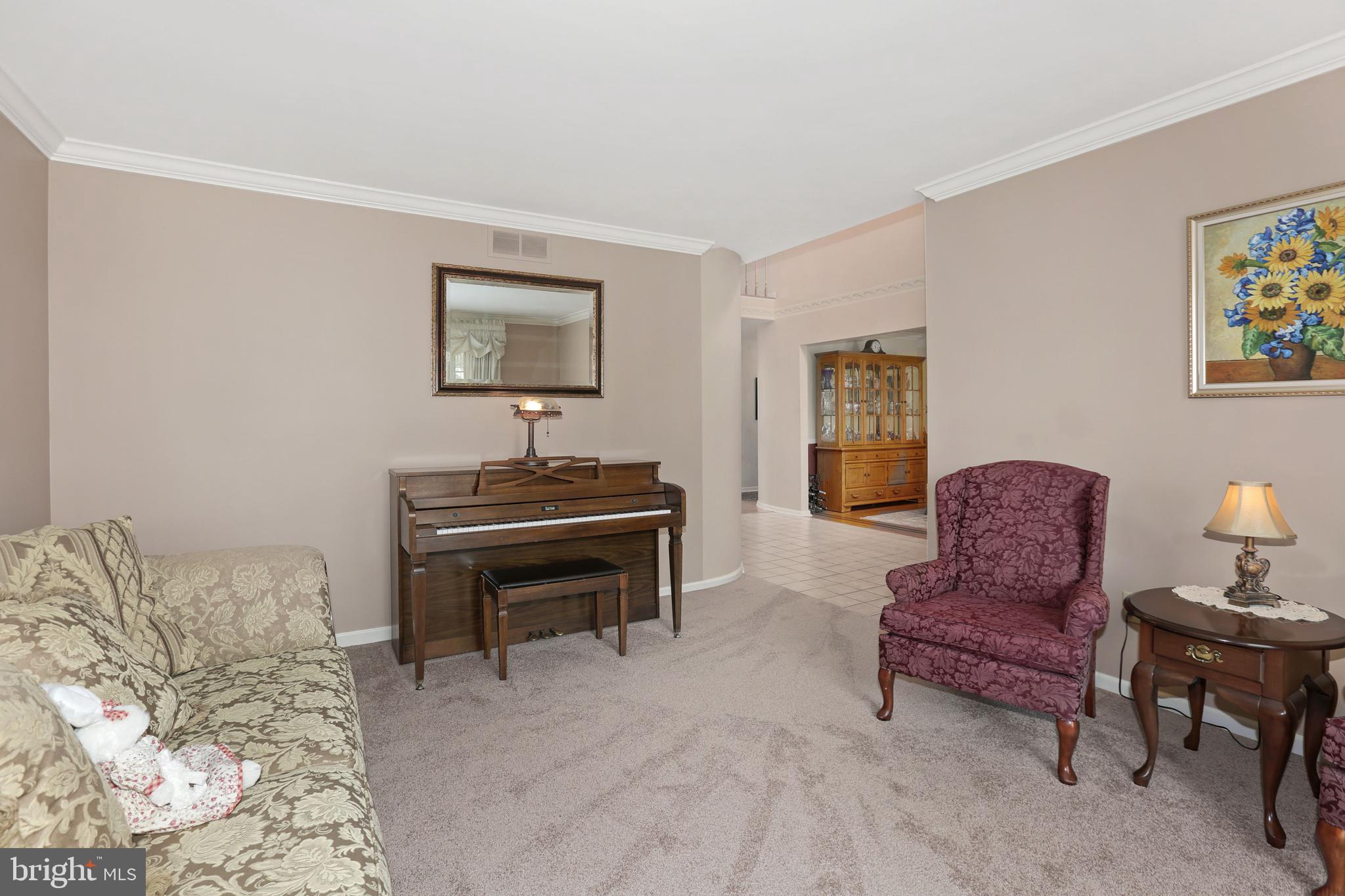 2 Burke Drive Medford, NJ 08055 - Photo 7 of 38 a living room with furniture and a piano