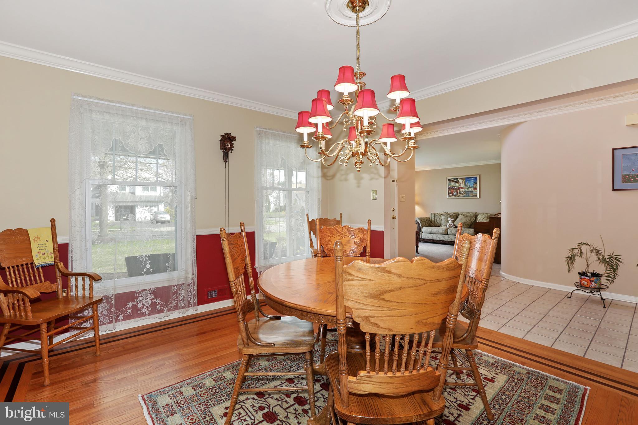 2 Burke Drive Medford, NJ 08055 - Photo 9 of 38 a view of a dining room with furniture wooden floor and chandelier