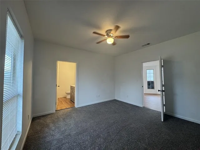 a view of empty room with windows
