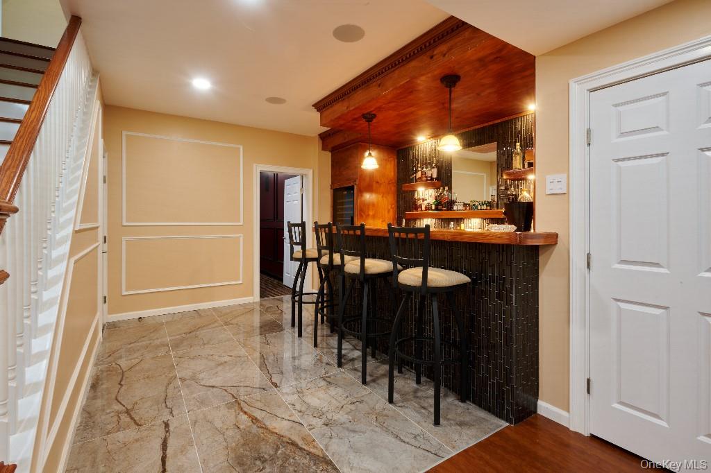 637 South Mountain Road New City, NY 10956 - Photo 16 of 36 a dining room with a table and chairs