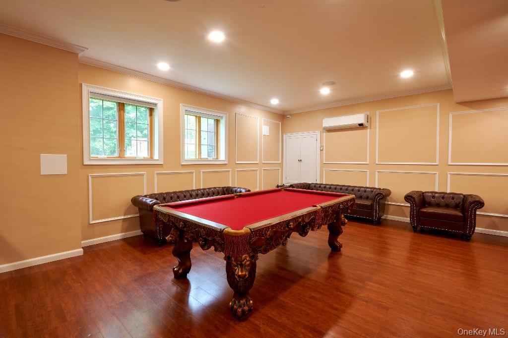 637 South Mountain Road New City, NY 10956 - Photo 18 of 36 a spacious bedroom with a bed and a couch