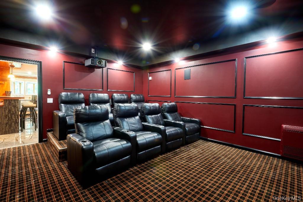 637 South Mountain Road New City, NY 10956 - Photo 20 of 36 a media room with lots of chairs and a projector