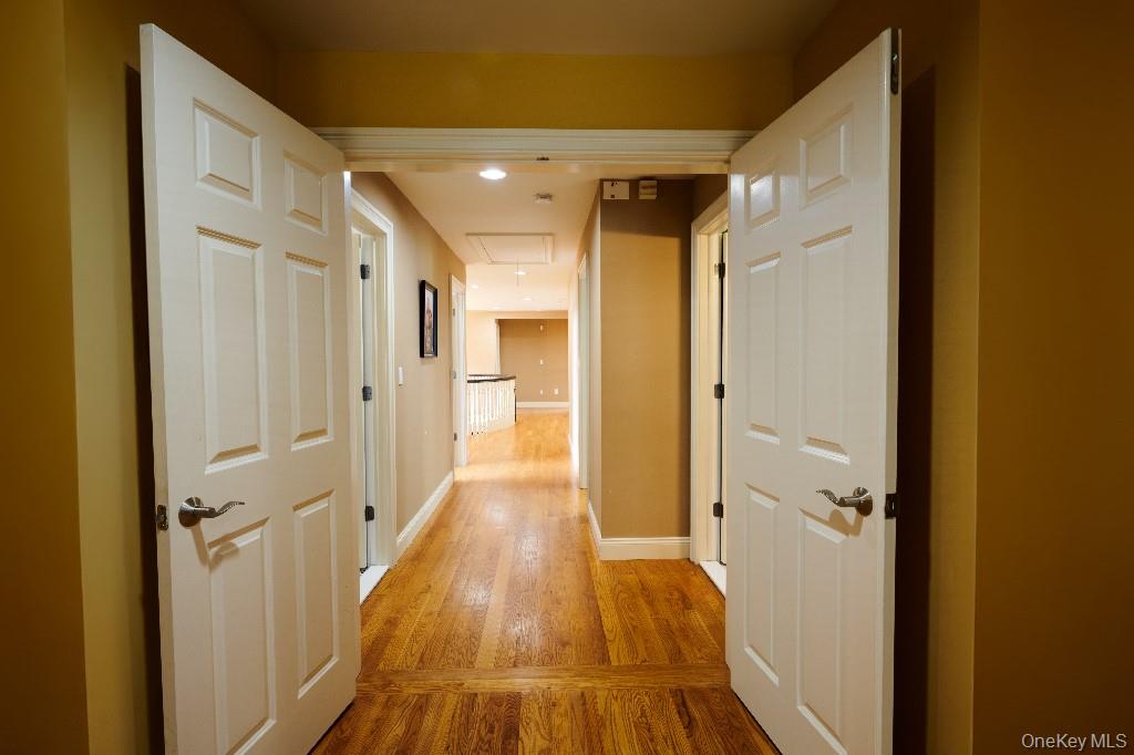 637 South Mountain Road New City, NY 10956 - Photo 27 of 36 a view of a hallway with wooden floor and a bathroom