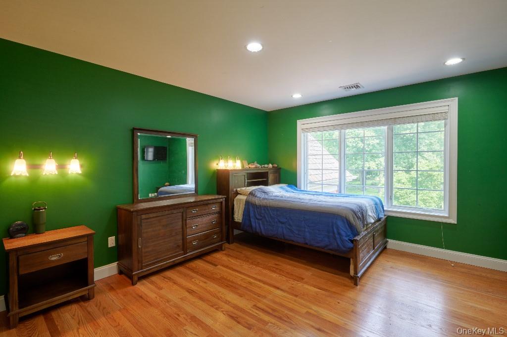 637 South Mountain Road New City, NY 10956 - Photo 28 of 36 a bedroom with a bed and a dresser